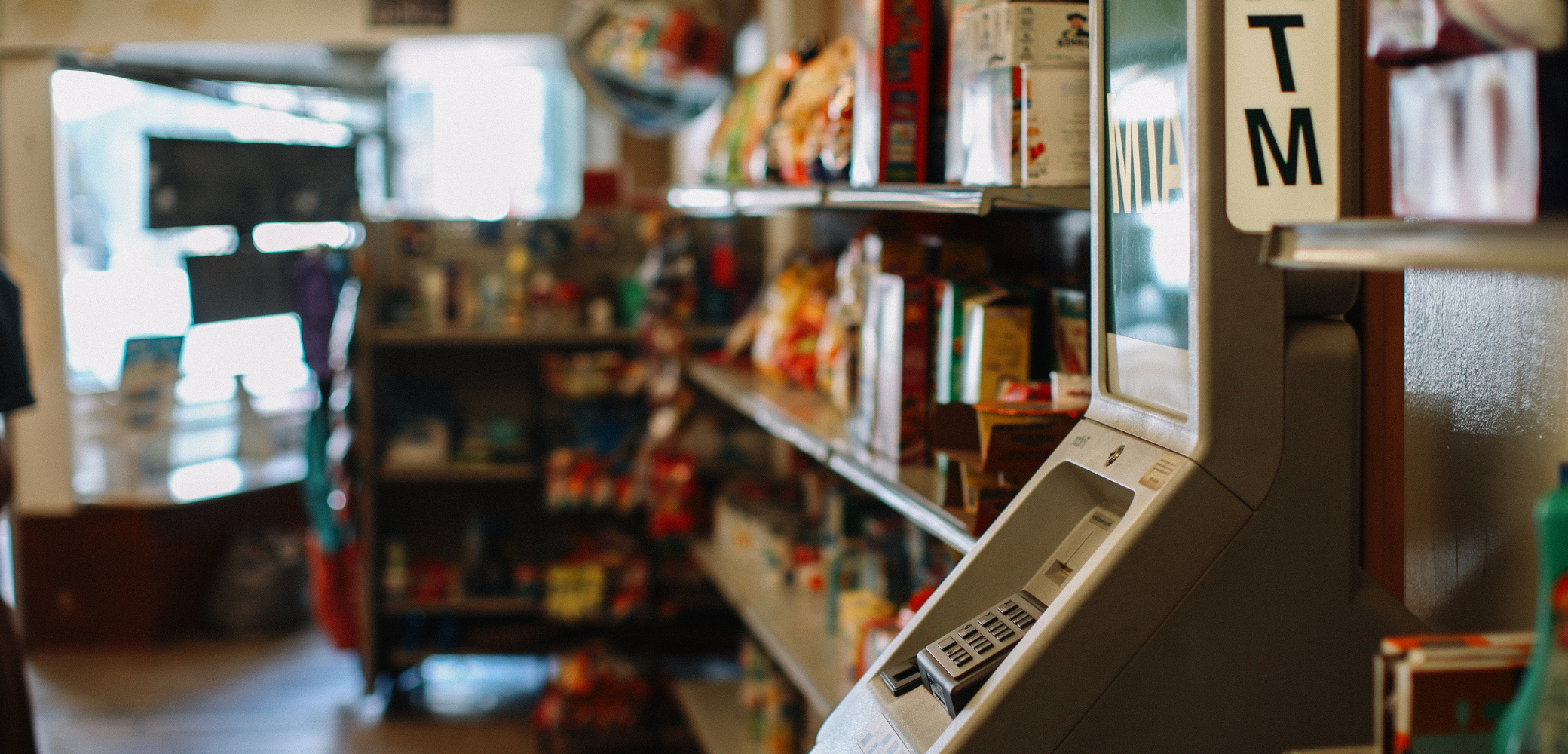 Business owner with ATM machine